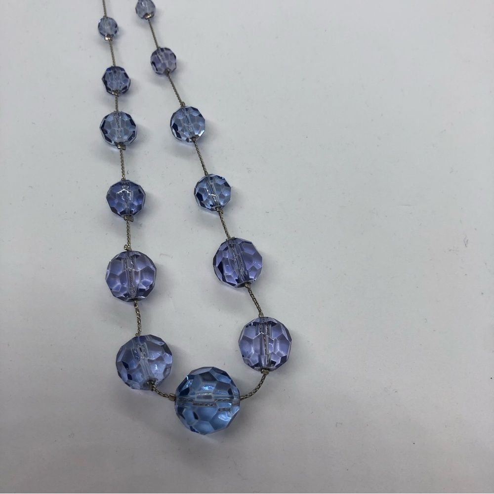 Light blue clear beads with silver tone chain necklace